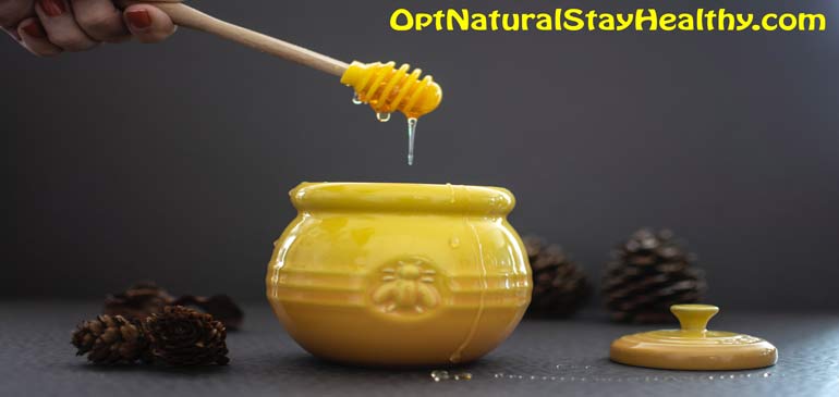 Fancy Image of Honey Dripping into a Yellow pot